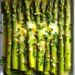 - 1 pound fresh asparagus, trimmed - 3 tablespoons unsalted butter - 2 tablespoons fresh lemon juice - 1 teaspoon lemon zest - 2 cloves garlic, minced - Salt and pepper to taste - 1 tablespoon freshly chopped parsley (for garnish) You can swap butter for olive oil or coconut oil for a different taste. If you want to add a fresh flavor, try using dill or thyme instead of parsley. You can also use garlic powder if you don't have fresh garlic on hand. Fresh asparagus is more tender and flavorful. You can find it in stores during spring. It cooks faster and keeps its bright color. If you use frozen asparagus, it’s best to thaw it first. To thaw, place it in the fridge overnight or run cold water over it for a few minutes. This helps keep the texture nice when cooking. - Rinse and trim asparagus: Start by rinsing 1 pound of fresh asparagus under cold water. Trim the woody ends off to keep the tender parts. This makes it easy to eat. - Gather all ingredients: For this dish, you need unsalted butter, lemon juice, lemon zest, garlic, salt, pepper, and parsley. Having everything ready helps the cooking go smoothly. - Melting butter and sautéing garlic: In a large skillet, melt 3 tablespoons of unsalted butter over medium heat. When it foams, add 2 cloves of minced garlic. Sauté for about 30 seconds to release the flavor but avoid browning the garlic. - Cooking the asparagus in the skillet: Add the trimmed asparagus to the skillet. Stir it well to coat all the pieces in the garlic butter. Cook for about 5 to 7 minutes. Turn the asparagus occasionally until it becomes tender and bright green. - Adding lemon juice and zest: Squeeze 2 tablespoons of fresh lemon juice over the asparagus. Sprinkle in 1 teaspoon of lemon zest, salt, and pepper to taste. Toss everything together to mix the flavors. - Serving suggestions and presentation tips: Cook for another minute to heat through. Remove the skillet from heat and garnish with 1 tablespoon of freshly chopped parsley. This adds color and a fresh touch to the dish. Serve your lemon butter asparagus warm for the best taste. For the full recipe, check the recipe section. To get the perfect tenderness in asparagus, focus on timing. Cook the asparagus for about 5-7 minutes. This method keeps it bright green and crisp. If you want a softer texture, add just one more minute. Always check it with a fork. You want it tender but not mushy. To avoid overcooking asparagus, stay close to the stove. Turn the asparagus occasionally while it cooks. This helps it cook evenly. If you notice it turning dull or limp, it’s overcooked. Remove it from the heat right away. To elevate the dish, consider adding spices like red pepper flakes or paprika. These add a nice kick without overpowering the lemon flavor. A pinch of nutmeg can also work wonders, giving a warm depth to the taste. Balancing acidity and richness is key. The lemon juice adds brightness while the butter adds creaminess. If you want more zing, add extra lemon juice. If it feels too tart, a pinch of sugar can help. Lemon butter asparagus pairs well with grilled chicken or fish. The bright flavors complement the richness of meats. For a vegetarian option, serve it with quinoa or couscous to round out the meal. For ideal side-dish complements, think about roasted potatoes or a fresh salad. These sides add texture and color, making the plate more appealing. You can also drizzle some of the lemon butter sauce over these dishes for a cohesive flavor. For more details on making this dish, check out the full recipe! {{image_2}} You can add seasonal vegetables to your lemon butter asparagus. Try fresh peas or cherry tomatoes. They add color and flavor. You can also use different citrus fruits. Lime or orange juice can brighten the dish in new ways. If you want a vegan or dairy-free version, swap the butter for olive oil. It keeps the dish light and tasty. For gluten-free options, rest assured this recipe is naturally gluten-free. Just check any other ingredients you may add. Want to change up the flavor? Try a Mediterranean twist. Add olives and feta cheese to the dish. This gives it a rich and salty taste. For an Asian-inspired version, use soy sauce and sesame oil. This will create a unique and savory meal. You can find the full recipe for lemon butter asparagus above. Enjoy experimenting! To store leftover lemon butter asparagus, let it cool first. Then, place it in an airtight container. This keeps the flavors fresh and helps maintain texture. I recommend using glass containers. They do a great job of sealing in moisture and flavor. The best method for reheating is in a skillet. Heat it over low heat. Add a small splash of water or lemon juice to keep it moist. Stir occasionally to warm it evenly. This method helps keep the asparagus tender and bright. Avoid using the microwave if you want to keep its crunch. Can you freeze lemon butter asparagus? Yes, you can! Here’s how to freeze it step-by-step: 1. Blanch the asparagus first. Boil it for 2-3 minutes, then shock it in ice water. This keeps the green color and taste. 2. Drain and dry the asparagus well. 3. Place it in a freezer-safe bag. Remove as much air as you can. 4. Label the bag with the date and freeze. Frozen lemon butter asparagus is best used within three months. When you are ready to eat it, thaw in the fridge overnight before reheating. Enjoy that fresh taste even in winter! How long does asparagus take to cook? Asparagus cooks quickly. It usually takes about 5 to 7 minutes in a skillet. The best sign is when it turns bright green and feels tender. For grilling, it may take a bit longer. What can I do with leftover lemon butter sauce? You can use leftover lemon butter sauce in many ways. Drizzle it over cooked fish or chicken. Toss it with pasta or use it in a salad dressing. You can even save it for a bread dip. Can I grill asparagus instead? Yes, grilling asparagus adds a smoky flavor. Just toss it with the lemon butter sauce before placing it on the grill. Cook for about 8 to 10 minutes, turning occasionally. What’s the best way to trim asparagus? To trim asparagus, hold a stalk in both hands. Bend it gently until it snaps. This break point is where the tough part ends. You can then cut the rest of the bunch to the same length. Can I use other kinds of butter? Absolutely! You can use garlic butter or herb butter for extra flavor. If you want a creamier taste, try using ghee or olive oil butter. Is there a way to make this recipe low-calorie? To make this recipe low-calorie, reduce the butter amount. You can also replace it with a light olive oil spray. Use less lemon juice to cut calories while keeping flavor. This blog post covers all you need for a delicious lemon butter asparagus dish. We talked about ingredients, how to cook, and tips for great taste. You learned about fresh and frozen asparagus, cooking techniques, and flavorful variations. Remember to store leftovers properly and try different herbs or spices to change things up. Whether as a side dish or a main event, this recipe will brighten your meals. Enjoy your cooking and feel free to explore new twists on this classic dish!