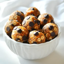 - 1 cup rolled oats - 1/2 cup canned pumpkin puree - 1/2 cup almond butter (or any nut butter of choice) - 1/4 cup honey or maple syrup - 1/4 cup ground flaxseed - 1-2 teaspoons pumpkin pie spice (or cinnamon) - 1/2 teaspoon vanilla extract - 1/4 cup chocolate chips (optional) - Pinch of salt I love these energy balls because they are simple and tasty. Each ingredient plays a role in flavor and texture. Rolled oats give a nice chewiness. Canned pumpkin adds a creamy texture and a hint of sweetness. Nut butter, like almond butter, binds everything together. You can swap it with peanut butter if you like. Sweeteners like honey or maple syrup add just the right touch of sweetness. Ground flaxseed boosts nutrition and helps with binding. Pumpkin pie spice or cinnamon adds warmth and that fall flavor we all love. A small dash of vanilla extract enhances the taste. If you want a chocolate kick, throw in some chocolate chips. The pinch of salt balances the sweetness. These ingredients come together to make a delightful treat that’s both satisfying and healthy. First, grab a large bowl. In this bowl, combine the following: - 1 cup rolled oats - 1/2 cup canned pumpkin puree - 1/2 cup almond butter (or any nut butter of choice) - 1/4 cup honey or maple syrup Next, add in: - 1/4 cup ground flaxseed - 1-2 teaspoons pumpkin pie spice (or cinnamon) - 1/2 teaspoon vanilla extract - A pinch of salt Mix everything well. You want the mixture to be sticky but still easy to handle. If you like, fold in 1/4 cup of chocolate chips for a sweet twist. Now, it's time to shape your mixture. Use your hands to scoop out small portions. Roll these portions into bite-sized balls. You should end up with about 12 to 15 balls. Once you have formed the balls, place them on a baking sheet lined with parchment paper. Refrigerate them for at least 30 minutes. This helps them firm up nicely. When ready to serve, use a decorative bowl. You can sprinkle a tiny bit of pumpkin pie spice on top for an extra touch. Enjoy your tasty, no-bake pumpkin energy balls! You can switch the almond butter for any nut butter you like. Peanut butter or sunflower seed butter works well too. If you want a sugar-free option, you can use stevia or monk fruit. These sweeteners can replace honey or maple syrup. To make the mixture firmer, add more oats or ground flaxseed. If it feels too dry, mix in a little more nut butter or pumpkin puree. When rolling the balls, your hands may get sticky. You can dampen your hands with water or oil. This will help the mixture roll easily. For extra nutrition, try adding chia seeds or hemp seeds to the mix. You can also include dried fruits like cranberries or raisins for a sweet twist. To serve, arrange the energy balls in a bowl and sprinkle pumpkin pie spice on top. This adds a fun touch for guests. {{image_2}} You can switch up the taste of your no bake pumpkin energy balls in fun ways. Try adding different spices like nutmeg or ginger. These spices give a warm and cozy flavor. You can also add dried fruits. Raisins, cranberries, or chopped dates work well. Nuts are another great option. Chopped walnuts or almonds can add a nice crunch. Feel free to mix and match these ingredients. Your energy balls will feel fresh and exciting every time you make them. When the holidays come, you can change the flavors to fit the season. For a festive touch, add a dash of peppermint extract for winter. You can also mix in cranberries for a tart bite. During fall, think about using apple pie spice instead of pumpkin pie spice. This gives a new twist while staying true to the autumn spirit. Each holiday can inspire a new recipe. These seasonal variations help keep your energy balls fun and interesting all year long. To keep your No Bake Pumpkin Energy Balls fresh, store them in the fridge. Use an airtight container to help maintain their texture and flavor. I like glass containers as they seal well and do not absorb odors. If you want to save your energy balls for later, freezing is a great option. Freeze them in a single layer on a baking sheet for a few hours. Once firm, transfer them to a freezer-safe bag or container. When you're ready to eat, thaw them in the fridge overnight. You can also enjoy them straight from the freezer for a cold treat! In the fridge, these energy balls last about a week. Look for signs of spoilage, like a strange smell or change in texture. If they feel dry or crumbly, it’s best to toss them out. Enjoy your delicious and healthy snack while they’re fresh! Yes, you can easily make these energy balls vegan. Just swap honey for maple syrup. Use any nut butter that fits your needs. If you want a nut-free option, try sunflower seed butter. This way, you keep the sweet flavor without using animal products. The prep time for these energy balls is just 10 minutes. After mixing, you chill them for at least 30 minutes. So, in total, you're looking at about 40 minutes from start to finish. This makes them a quick and easy snack option. These energy balls pair well with many snacks and meals. Try them with fresh fruit or yogurt for a balanced treat. You could also serve them with a warm drink, like chai tea or coffee. They make a great on-the-go snack for busy days. Yes, these energy balls are quite healthy. They are packed with fiber from the oats and flaxseed. The pumpkin adds vitamins and minerals, while nut butter gives healthy fats. Each ball has about 100 calories, making them a great energy boost without the guilt. This blog post covered making delicious No Bake Pumpkin Energy Balls with simple ingredients. You learned about mixing oats, pumpkin, nut butter, and spices. I shared tips for making them firmer or experimenting with flavors. Storage methods keep these treats fresh longer. These energy balls are easy to customize and perfect for snacks. Enjoy making and sharing them with friends and family!